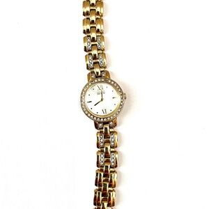 Elegant ladies gold watch adorned with diamonds